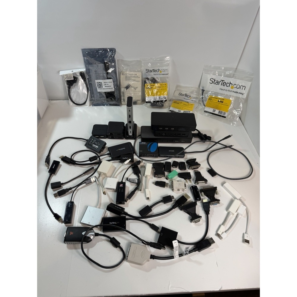 Large Set of Docking Stations, Cables, and Adapters